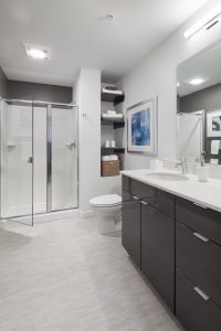 Bathrooms at The Carter offer a luxurious space with extra shelving, and a stand-up shower in select units!